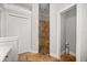 Bathroom featuring a walk-in shower with stone floors and walls at 28924 Discovery Rd, Tavares, FL 32778