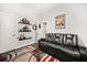 Bedroom showcasing a sleek black sofa and a creative display of ship models at 28924 Discovery Rd, Tavares, FL 32778