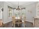 Bright breakfast nook with a round table and a view to the backyard at 28924 Discovery Rd, Tavares, FL 32778