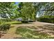 A long driveway leads to this attractive home with a lush, green front lawn at 28924 Discovery Rd, Tavares, FL 32778