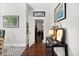 Hallway with wood floors, neutral paint, and bright lighting at 28924 Discovery Rd, Tavares, FL 32778