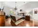 Main bedroom with hardwood floors, neutral paint, and decorative furnishings at 28924 Discovery Rd, Tavares, FL 32778