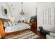 Main bedroom with hardwood floors, neutral paint, and walk-in closet at 28924 Discovery Rd, Tavares, FL 32778
