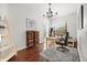 Bright office with a wooden desk, woven baskets, a decorative ladder, and a patterned rug at 28924 Discovery Rd, Tavares, FL 32778