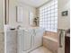 Comfortable bathroom featuring a walk-in tub with safety features and tile flooring at 2954 Cedar Grove Loop, The Villages, FL 32163