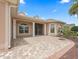 Welcoming front porch with brick flooring, elegant columns, and a decorative fountain at 2954 Cedar Grove Loop, The Villages, FL 32163