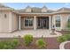 Welcoming front porch with brick flooring, elegant columns, and detailed windows at 2954 Cedar Grove Loop, The Villages, FL 32163