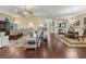 Open concept living room and dining room with hard wood floors at 2954 Cedar Grove Loop, The Villages, FL 32163