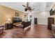 Expansive main bedroom offering hardwood floors, tray ceiling, and two large windows for natural light at 2954 Cedar Grove Loop, The Villages, FL 32163