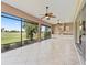 The covered patio has a full outdoor kitchen and views of the golf course at 2954 Cedar Grove Loop, The Villages, FL 32163