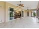 Covered lanai features access to the dining room and a view of the property's exterior at 2954 Cedar Grove Loop, The Villages, FL 32163