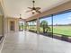 The covered lanai has views of the lush golf course and tropical landscaping at 2954 Cedar Grove Loop, The Villages, FL 32163