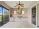 The screened patio boasts a full outdoor kitchen, perfect for entertaining guests at 2954 Cedar Grove Loop, The Villages, FL 32163