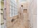 Accessible shower stall with grab bars, hand-held shower head and stylish tile at 2954 Cedar Grove Loop, The Villages, FL 32163