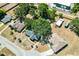 Aerial view of neighborhood featuring mature shade trees and well-kept homes at 307 Water Shore Dr, Leesburg, FL 34748