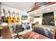 Creative bedroom with multiple guitars, a TV, and a keyboard-themed rug at 307 Water Shore Dr, Leesburg, FL 34748