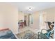Bright bonus room featuring tile floors, a desk, and doorways leading to other rooms at 307 Water Shore Dr, Leesburg, FL 34748