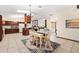 Open-concept kitchen and dining area with lots of natural light and convenient access to the living space at 307 Water Shore Dr, Leesburg, FL 34748