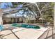 Relaxing screened pool with lounge chairs and room for entertaining at 307 Water Shore Dr, Leesburg, FL 34748