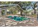Screened pool with colorful floats and chairs providing a backyard oasis at 307 Water Shore Dr, Leesburg, FL 34748