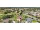 Expansive aerial view of a residential community featuring well-manicured lawns and a golf course at 3319 Barrington Ct, The Villages, FL 32162