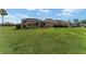 Sprawling backyard featuring lush green grass and manicured landscaping at 3319 Barrington Ct, The Villages, FL 32162