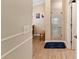 Bathroom featuring stand up shower, blue rug, and light wood vinyl flooring at 3319 Barrington Ct, The Villages, FL 32162