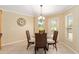 Bright breakfast nook featuring a glass-top table, perfect for enjoying morning meals at 3319 Barrington Ct, The Villages, FL 32162