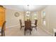 Cozy breakfast nook with a glass table and charming decor, perfect for casual meals at 3319 Barrington Ct, The Villages, FL 32162