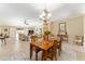 Open floorplan dining area with table set, chandelier, and seamless access to living spaces at 3319 Barrington Ct, The Villages, FL 32162