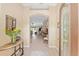 Inviting home foyer showcasing tile flooring and an open entryway to the living area at 3319 Barrington Ct, The Villages, FL 32162
