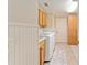Functional laundry room with side-by-side washer and dryer, built-in cabinets, and a sink at 3319 Barrington Ct, The Villages, FL 32162