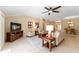 Inviting living room with neutral tones, tile flooring, and plenty of natural light at 3319 Barrington Ct, The Villages, FL 32162
