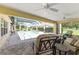 Inviting pool area with spa, outdoor seating, a grill, and shaded lounge area for relaxation at 3319 Barrington Ct, The Villages, FL 32162
