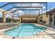 Inviting pool and spa area with screened lanai, perfect for outdoor entertaining and enjoying the Florida sunshine at 3319 Barrington Ct, The Villages, FL 32162