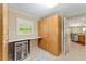 Spacious storage area with cabinets, a counter, beverage fridge, and open access to kitchen at 3319 Barrington Ct, The Villages, FL 32162