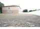 Large, empty backyard surrounded by a white fence at 3329 White Blossom Ln, Clermont, FL 34711