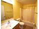 Bathroom featuring a toilet, a shower with a curtain, a sink and a large mirror at 3329 White Blossom Ln, Clermont, FL 34711
