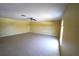 Open-concept living room with tile floors, ceiling fan, and natural light at 3329 White Blossom Ln, Clermont, FL 34711