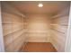 Walk-in pantry with multiple shelves for storage at 3329 White Blossom Ln, Clermont, FL 34711