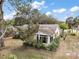 Aerial view of a charming home with a well-maintained backyard at 34 Gordon Ct, Leesburg, FL 34788