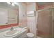 Bathroom featuring stand-up shower, floral wallpaper, and tiled floor at 34 Gordon Ct, Leesburg, FL 34788