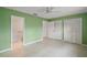 Spacious bedroom featuring three closets and attached bath at 34 Gordon Ct, Leesburg, FL 34788