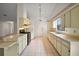 Well-lit kitchen with ample counter space, cabinetry, and updated appliances at 34 Gordon Ct, Leesburg, FL 34788