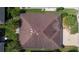Overhead view displaying a well-maintained roof and lush green landscape of a private residence at 3433 Nestlebranch Ave, The Villages, FL 32163