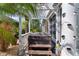 Backyard hot tub with privacy wall, pergola and tropical landscaping at 3433 Nestlebranch Ave, The Villages, FL 32163