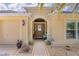 Welcoming front porch with decorative accents and manicured landscaping at 3433 Nestlebranch Ave, The Villages, FL 32163