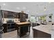 Updated kitchen with stainless steel appliances and butcher block island at 3433 Nestlebranch Ave, The Villages, FL 32163