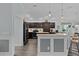 Spacious kitchen with stainless steel appliances, and a breakfast bar at 3433 Nestlebranch Ave, The Villages, FL 32163