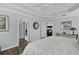 Bright, spacious main bedroom with tray ceiling, ceiling fan, walk-in closet and wood-look floors at 3433 Nestlebranch Ave, The Villages, FL 32163